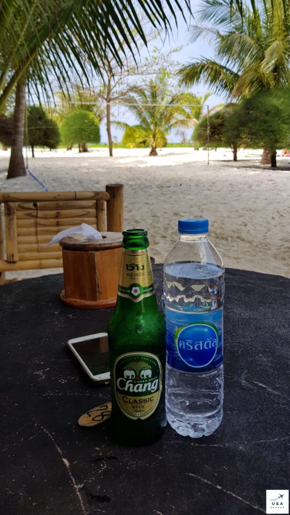 beer and water on table beach koh phangan